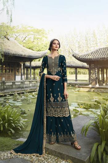 Enhance Your Personality Wearing This Heavy Designer Straight suit In Teal Blue Color. It Pretty Embroidered Top, Bottom and Dupatta Are Fabricated On Georgette Which Is Light In Weight And Easy To Carry Throughout The Gala. 