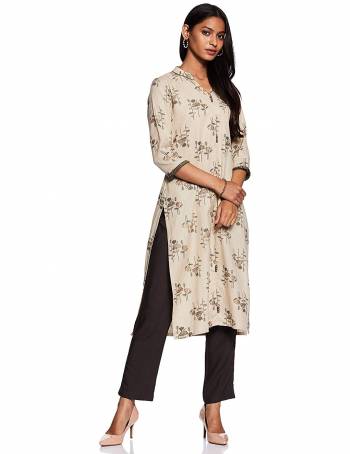 Here Is A Beautiful Readymade Pair Of Kurti With Bottom In Cream And Black Color. This Kurti Is Fabricated On Cotton Beautified With Prints Paired with Rayon Fabricated Plain Bottom. 