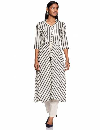 Add This Readymade Kurti To Your Wardrobe In White and Grey Color Fabricated On Cotton Beautified With Lining Prints. It Is Light In Weight And Easy To Carry All Day Long. 