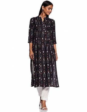 Add This Readymade Kurti To Your Wardrobe In Black Color Fabricated On Rayon Beautified With Ikkat Prints. It Is Light In Weight And Easy To Carry All Day Long. 