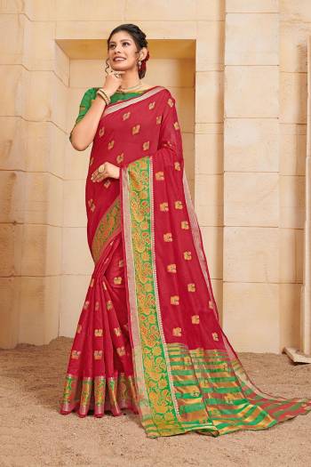 Add This  Beautiful And Attractive Looking Designer Saree In Red Color Paired with Contrasting Green Colored Blouse. This Saree and Blouse Are Fabricated On Cotton Beautified With Weave. 
