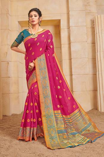 Celebrate This Festive Season Wearing This Lovely Weaved Designer Saree In Dark Pink Color Paired With Contrasting Blue Colored Blouse. This Saree And Blouse Are Fabricated On Cotton Which Also Gives A Rich Look To Your Personality. 