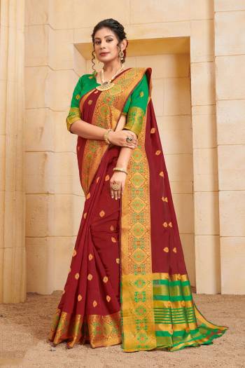 Add This  Beautiful And Attractive Looking Designer Saree In Maroon Color Paired with Contrasting Green Colored Blouse. This Saree and Blouse Are Fabricated On Cotton Beautified With Weave. 