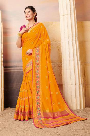 Celebrate This Festive Season Wearing This Lovely Weaved Designer Saree In Musturd Yellow Color Paired With Contrasting Rani Pink Colored Blouse. This Saree And Blouse Are Fabricated On Cotton Which Also Gives A Rich Look To Your Personality. 