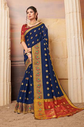 Celebrate This Festive Season Wearing This Lovely Weaved Designer Saree In Navy Blue Color Paired With Contrasting Maroon Colored Blouse. This Saree And Blouse Are Fabricated On Cotton Which Also Gives A Rich Look To Your Personality. 