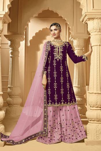 Here Is A Very Beautiful Designer Heavy Suit In Purple Color Paired With Light Purple Colored bottom And Dupatta. Its Embroidered Top And Bottom Are Georgette Based Paired with Net Fabricated Dupatta. 