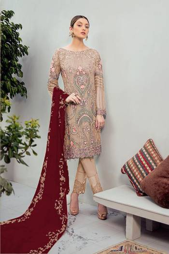 Grab This Beautiful Heavy Designer Pakistani Straight Suit In Beige Color Paired With Maroon Colored Dupatta. Its Heavy Embroidered Top Is Fabricated On Georgette Paired With Santoon Bottom and Georgette Fabricated Embroidered Dupatta. 