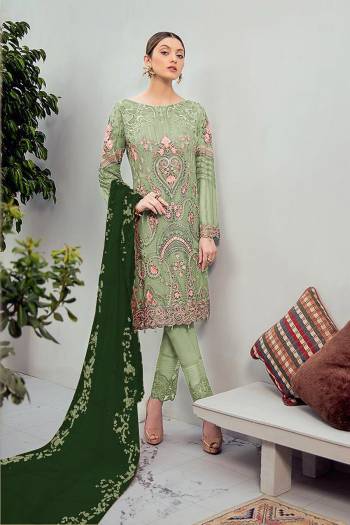 Grab This Beautiful Heavy Designer Pakistani Straight Suit In Light Green Color Paired With Green Colored Dupatta. Its Heavy Embroidered Top Is Fabricated On Georgette Paired With Santoon Bottom and Georgette Fabricated Embroidered Dupatta. 