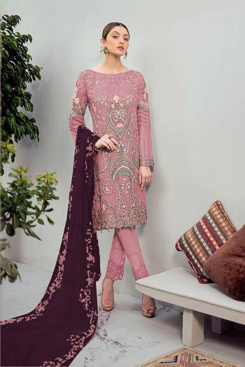 Grab This Beautiful Heavy Designer Pakistani Straight Suit In Dusty Pink Color Paired With Purple Colored Dupatta. Its Heavy Embroidered Top Is Fabricated On Georgette Paired With Santoon Bottom and Georgette Fabricated Embroidered Dupatta. 