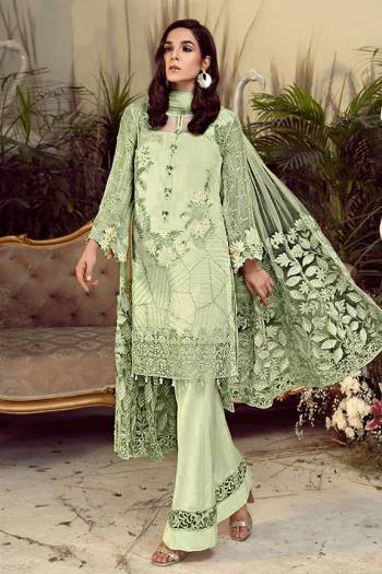 Grab This Pretty Heavy Embroidered Pakistani Designer Suit In Pastel Green Color. Its Embroidered Top Is Georgette Based Paired With Santoon Bottom and Net Fabricated Embroidered Dupatta. 