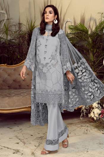 Grab This Pretty Heavy Embroidered Pakistani Designer Suit In Grey Color. Its Embroidered Top Is Georgette Based Paired With Santoon Bottom and Net Fabricated Embroidered Dupatta. 