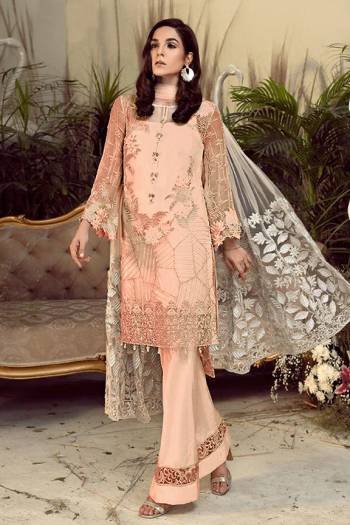 Grab This Pretty Heavy Embroidered Pakistani Designer Suit In Peach Color. Its Embroidered Top Is Georgette Based Paired With Santoon Bottom and Net Fabricated Embroidered Dupatta. 