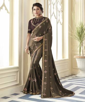 Flaunt Your Rich And Elegant Taste Wearing This Designer Saree In Light Brown Color Paired With Dark Brown Colored Blouse. This Saree Is Fabricated On Satin Silk Paired With Art Silk Fabricated Blouse. 