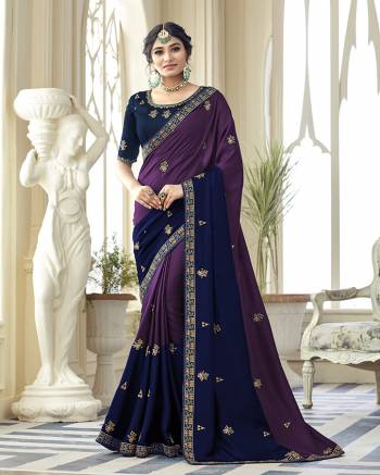 You Will Definitely Earn Lots Of Compliments Wearing This Designer Saree In Purple And Navy Blue Color Paired With Contrasting Navy Blue Colored Blouse. This Embroidered Saree Is Satin Silk Based Paired With Art Silk Fabricated Blouse. Buy Now.