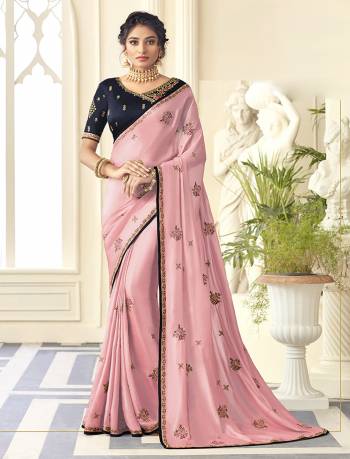 Flaunt Your Rich And Elegant Taste Wearing This Designer Saree In Pink Color Paired With Navy Blue Colored Blouse. This Saree Is Fabricated On Satin Silk Paired With Art Silk Fabricated Blouse. 