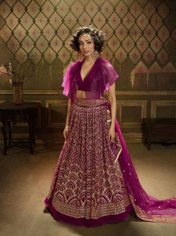 Get Ready For This Wedding Season Wearing This Heavy Designer Lehenga Choli In Rani Pink Color. This Beautiful Heavy Embroidered Lehenga Choli Is Fabricated On Net Beautified With Jari Embroidery And Sequence Work. 