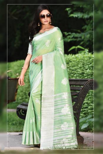 For Your Semi-Casual Or Festive Wear, Grab This Pretty Designer Saree In Light Green Color. This Saree And Blouse Are Fabricated On Linen Cotton Beautified With Weave. Buy This Elegant Looking Saree Now. 