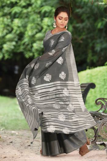 For Your Semi-Casual Or Festive Wear, Grab This Pretty Designer Saree In Grey Color. This Saree And Blouse Are Fabricated On Linen Cotton Beautified With Weave. Buy This Elegant Looking Saree Now. 