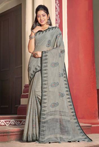 Flaunt Your Rich and Elegant Taste Wearing This Designer Saree In Grey Color Paired With Grey Colored Blouse. This Saree And Blouse Are Fabricated On Linen Cotton Beautified With Thread Work. Its Rich And Fabric Will Earn You Lots Of Compliments From Onlookers. 