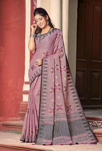 Simple And Elegant Looking Linen Based Designer Saree Is Here In Pink Color Paired With Grey Colored Blouse. This Saree And Blouse Are Fabricated On Linen Cotton Beautified With Thread Work. 