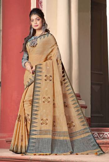 Flaunt Your Rich and Elegant Taste Wearing This Designer Saree In Occur Yellow Color Paired With Grey Colored Blouse. This Saree And Blouse Are Fabricated On Linen Cotton Beautified With Thread Work. Its Rich And Fabric Will Earn You Lots Of Compliments From Onlookers. 