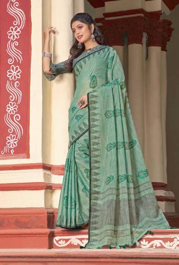 Simple And Elegant Looking Linen Based Designer Saree Is Here In Sea Green Color Paired With Grey Colored Blouse. This Saree And Blouse Are Fabricated On Linen Cotton Beautified With Thread Work. 