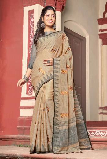 Flaunt Your Rich and Elegant Taste Wearing This Designer Saree In Beige Color Paired With Grey Colored Blouse. This Saree And Blouse Are Fabricated On Linen Cotton Beautified With Thread Work. Its Rich And Fabric Will Earn You Lots Of Compliments From Onlookers. 