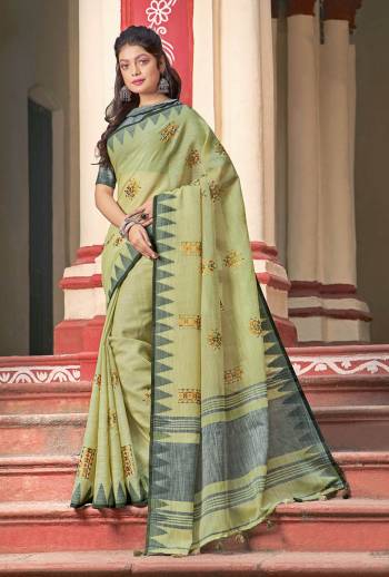 Simple And Elegant Looking Linen Based Designer Saree Is Here In Light Green Color Paired With Grey Colored Blouse. This Saree And Blouse Are Fabricated On Linen Cotton Beautified With Thread Work. 