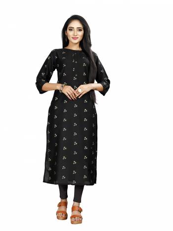 Here Is Simple And Elegant Looking Readymade Straight Kurti In Black Color. This Kurti Is Fabricated On Muslin Beautified With Foil Prints And Available In All Regular Sizes. 