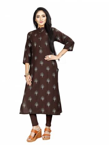 Here Is Simple And Elegant Looking Readymade Straight Kurti In Brown Color. This Kurti Is Fabricated On Muslin Beautified With Foil Prints And Available In All Regular Sizes. 