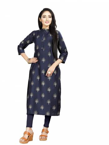 Here Is Simple And Elegant Looking Readymade Straight Kurti In Navy Blue Color. This Kurti Is Fabricated On Muslin Beautified With Foil Prints And Available In All Regular Sizes. 