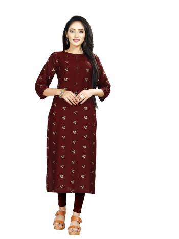 Here Is Simple And Elegant Looking Readymade Straight Kurti In Maroon Color. This Kurti Is Fabricated On Muslin Beautified With Foil Prints And Available In All Regular Sizes. 