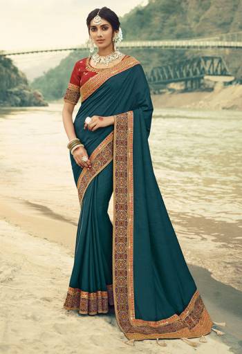 Here Is A Beautiful Designer Saree In Blue Color Paired With Contrasting Red Colored Blouse. This Saree Is Fabricated On Vichitra Silk With Jacquard Silk Border Paired With Art Silk Fabricated Blouse. This Pretty Saree Is Easy To Drape And Carry All Day Long. Buy Now.