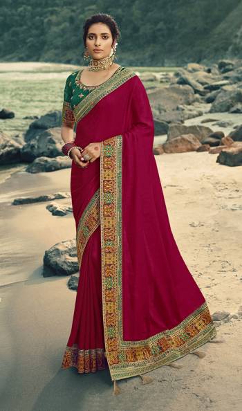 Flaunt Your Rich and Elegant Taste Wearing This Designer Saree In Magenta Pink Color Paired With Dark Green Colored Blouse. This Saree Is Fabricated On Vichitra Silk Paired With Art Silk Fabricated Blouse. Its Rich Fabric And Color Will Earn You Lots Of Compliments From Onlookers. 