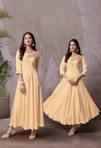 Celebrate This Festive Season With Beauty And Comfort Wearing This Readymade Long Kurti In Cream Color Fabricated Rayon. This Pretty Kurti Is Beautified With Multi Colored Thread Work Giving An Attractive Look. Also It Is Available In All Regular Sizes. 