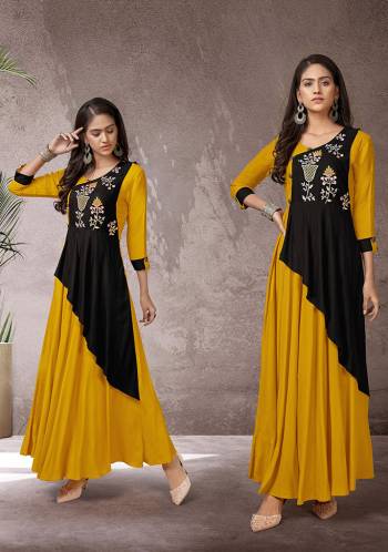 Celebrate This Festive Season With Beauty And Comfort Wearing This Readymade Long Kurti In Musturd Yellow And Black Color Fabricated Rayon. This Pretty Kurti Is Beautified With Multi Colored Thread Work Giving An Attractive Look. Also It Is Available In All Regular Sizes. 