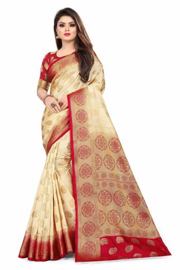 For A Proper Traditional Look, Grab This Heavy Weaved Silk Based Designer Saree In Cream Color Paired with Red Colored blouse. This Saree and Blouse Are Fabricated On Art Silk Which Gives A Rich Look To Your Personality. 