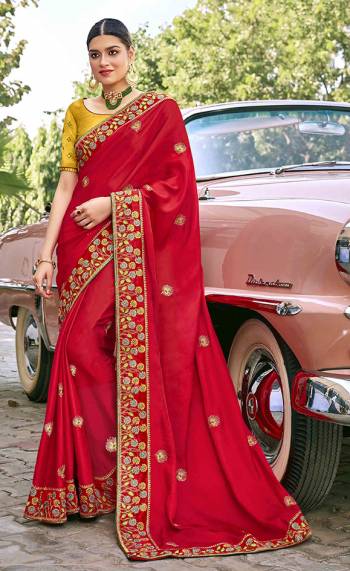 Adorn The Pretty Angelic Look Wearing This Heavy Designer Saree In Red Color Paired With Contrasting Yellow Colored Blouse. This Saree Is Fabricated On Satin Silk Paired With Art Silk Fabricated Blouse. Its Pretty Color Pallete Will Give An Attractive Look To Your Personality. 