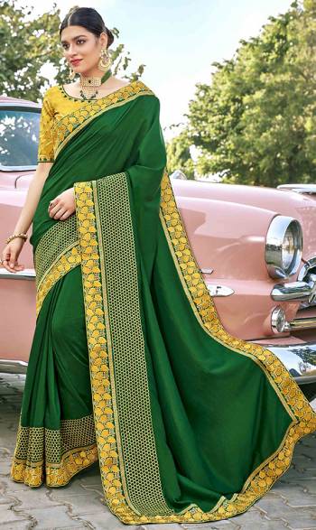 Grab This Pretty Elegant Looking Designer Saree In Green Color Paired With Contrasting Yellow Colored Blouse. This Saree And Blouse Are Silk Based Beautified With Embroidery. Buy Now.